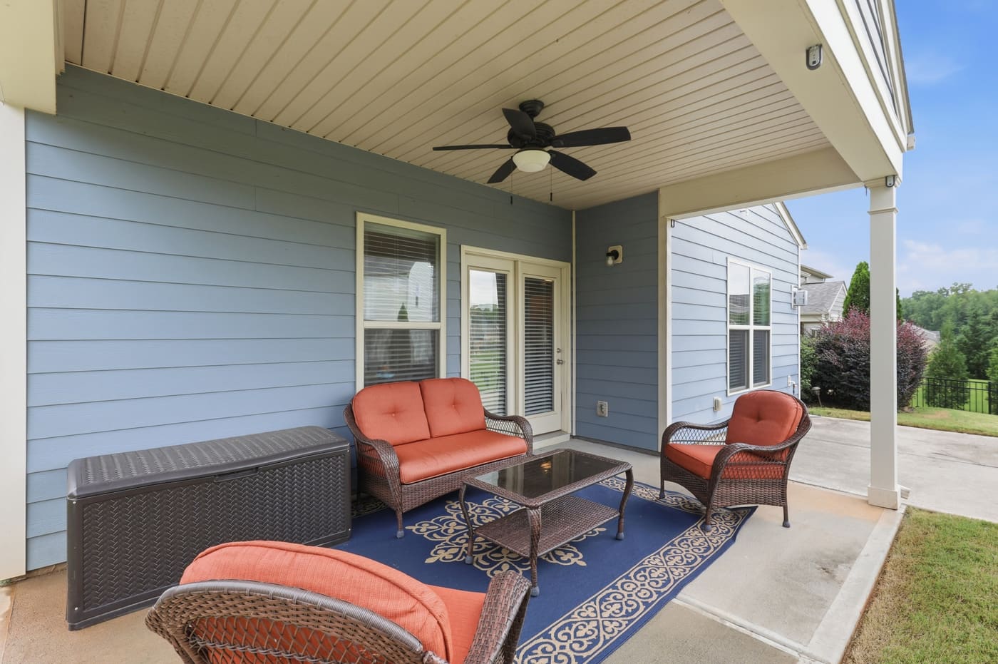 The covered rear porch running the width of the back of the house.